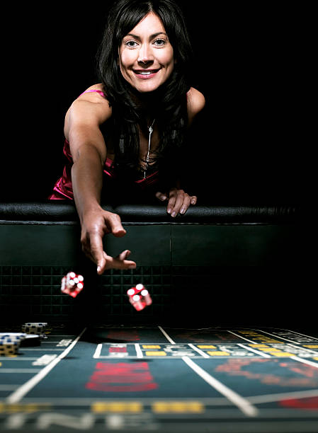 Table layout with clear card and chip positioning. Wide-angle view of live blackjack table with dealer, card shoes, and chip trays